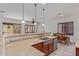 Bright kitchen area featuring stainless steel appliances and an adjacent dining area with a wood table at 1231 W Hawken Way, Chandler, AZ 85286