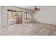 Spacious living room with tile flooring, sliding glass doors, and natural light at 1231 W Hawken Way, Chandler, AZ 85286