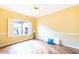 Bright bedroom with hardwood floors, window with shutters, and neutral walls at 17808 N Navarro Ct, Surprise, AZ 85374