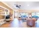 Bright living room with hardwood floors, large windows, and comfortable seating at 17808 N Navarro Ct, Surprise, AZ 85374