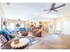 Living room features hardwood floors, open floor plan, and access to kitchen at 17808 N Navarro Ct, Surprise, AZ 85374
