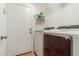 Convenient laundry room with washer, dryer, and shelving at 20424 N 96Th Ln, Peoria, AZ 85382