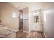 Bathroom featuring a glass enclosed shower, dual sinks, and tile flooring at 21165 W Carver Rd, Buckeye, AZ 85326