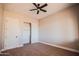 Bedroom featuring a ceiling fan, closet, and neutral carpet at 21165 W Carver Rd, Buckeye, AZ 85326