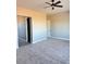 Large bedroom with carpet flooring and ceiling fan at 21165 W Carver Rd, Buckeye, AZ 85326