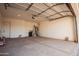Spacious garage with ample room for storage, garage door opener, and concrete flooring at 21165 W Carver Rd, Buckeye, AZ 85326