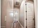 Hallway with wood-look flooring, white walls, and white doors leads to other rooms at 21165 W Carver Rd, Buckeye, AZ 85326
