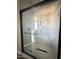 Modern shower with glass enclosure and herringbone tile at 21165 W Carver Rd, Buckeye, AZ 85326