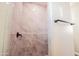 Close-up of a tiled shower with brushed black fixtures, showcasing modern design and functionality at 21165 W Carver Rd, Buckeye, AZ 85326
