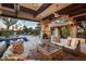 Outdoor patio with fireplace and pool view at 22402 N 84Th Pl, Scottsdale, AZ 85255