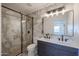 Modern bathroom with marble tile and double vanity at 2329 E Turney Ave, Phoenix, AZ 85016