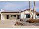 White single story home with black roof and landscaping at 7644 E Bonita Dr, Scottsdale, AZ 85250