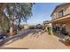 Large backyard with paver patio and mature tree at 8934 W Ocotillo Rd, Glendale, AZ 85305
