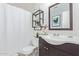 Bathroom with dark vanity and white sink at 8934 W Ocotillo Rd, Glendale, AZ 85305