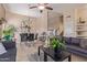 Open dining area with glass table, chairs and adjacent living room at 8934 W Ocotillo Rd, Glendale, AZ 85305