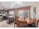 Kitchen nook with wood table and seating for six at 8934 W Ocotillo Rd, Glendale, AZ 85305