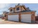Two-story house with brick facade and a three-car garage at 8934 W Ocotillo Rd, Glendale, AZ 85305