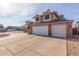 Two-story house with a brick facade and three-car garage at 8934 W Ocotillo Rd, Glendale, AZ 85305