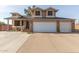 Two-story house with a brick facade, three-car garage, and landscaped front yard at 8934 W Ocotillo Rd, Glendale, AZ 85305