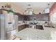 Well-equipped kitchen with stainless steel appliances and an island at 8934 W Ocotillo Rd, Glendale, AZ 85305