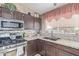 Modern kitchen with granite countertops and stainless steel appliances at 8934 W Ocotillo Rd, Glendale, AZ 85305