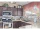 Updated kitchen with granite counters and microwave at 8934 W Ocotillo Rd, Glendale, AZ 85305