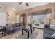 Bright living room with bay window, comfy couches, and a ceiling fan at 8934 W Ocotillo Rd, Glendale, AZ 85305