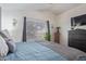 Main bedroom with a dresser and a window with blinds at 8934 W Ocotillo Rd, Glendale, AZ 85305