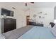 Main bedroom with a large bed and a walk-in closet at 8934 W Ocotillo Rd, Glendale, AZ 85305