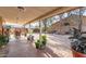 Covered patio with seating area and lush greenery at 8934 W Ocotillo Rd, Glendale, AZ 85305