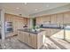 Modern kitchen with wood cabinets, center island, and stainless steel appliances at 10040 E Happy Valley Rd # 2001, Scottsdale, AZ 85255