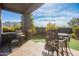 Covered patio with outdoor seating, grill, and mountain views at 10040 E Happy Valley Rd # 2001, Scottsdale, AZ 85255