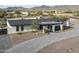 Single-story home with a modern design, paver driveway, and mountain views at 12524 E Saddlehorn Trl, Scottsdale, AZ 85259