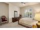 Bright bedroom with carpeted floor, a large window, and a comfortable bed at 13216 N 14Th Way, Phoenix, AZ 85022