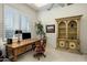 Home office with built-in shelving and a large desk at 13216 N 14Th Way, Phoenix, AZ 85022