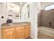 Bathroom featuring vanity with granite countertops and a bathtub at 14539 W Sheridan St, Goodyear, AZ 85395