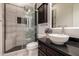 Updated bathroom with a glass enclosed shower and modern sink at 14539 W Sheridan St, Goodyear, AZ 85395