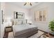 Bedroom with carpet, ceiling fan, window with shutters and tastefully decorated at 14539 W Sheridan St, Goodyear, AZ 85395