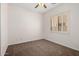 Bedroom with carpet, a ceiling fan and window with shutters at 14539 W Sheridan St, Goodyear, AZ 85395