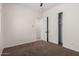 Empty bedroom with carpet and a closet with sliding doors at 14539 W Sheridan St, Goodyear, AZ 85395