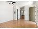 An empty, spacious bedroom with hard floors and a ceiling fan at 14539 W Sheridan St, Goodyear, AZ 85395