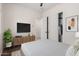 Bedroom with carpet, ceiling fan, and closet with sliding doors at 14539 W Sheridan St, Goodyear, AZ 85395