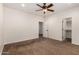 Spacious bedroom offers neutral walls and a ceiling fan, providing a bright and comfortable space to relax at 14539 W Sheridan St, Goodyear, AZ 85395