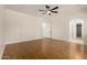 Spacious bedroom features hardwood floors, neutral paint, and an open layout for easy customization at 14539 W Sheridan St, Goodyear, AZ 85395