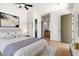 A beautifully staged bedroom with hardwood floors, decor, and modern furnishings at 14539 W Sheridan St, Goodyear, AZ 85395