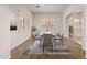 Bright dining room features neutral walls, shuttered windows, and a stylish table setting for elegant meals at 14539 W Sheridan St, Goodyear, AZ 85395
