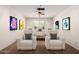 Home theater featuring comfortable seating, a projector, and movie posters for an immersive entertainment experience at 14539 W Sheridan St, Goodyear, AZ 85395