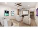 Home theater featuring comfortable seating, a projector, and movie posters for an immersive entertainment experience at 14539 W Sheridan St, Goodyear, AZ 85395
