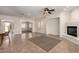 Inviting living area with fireplace and tiled floors offers easy access to other spaces at 14539 W Sheridan St, Goodyear, AZ 85395