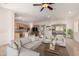 Bright living room with seamless flow to the kitchen and dining area at 14539 W Sheridan St, Goodyear, AZ 85395